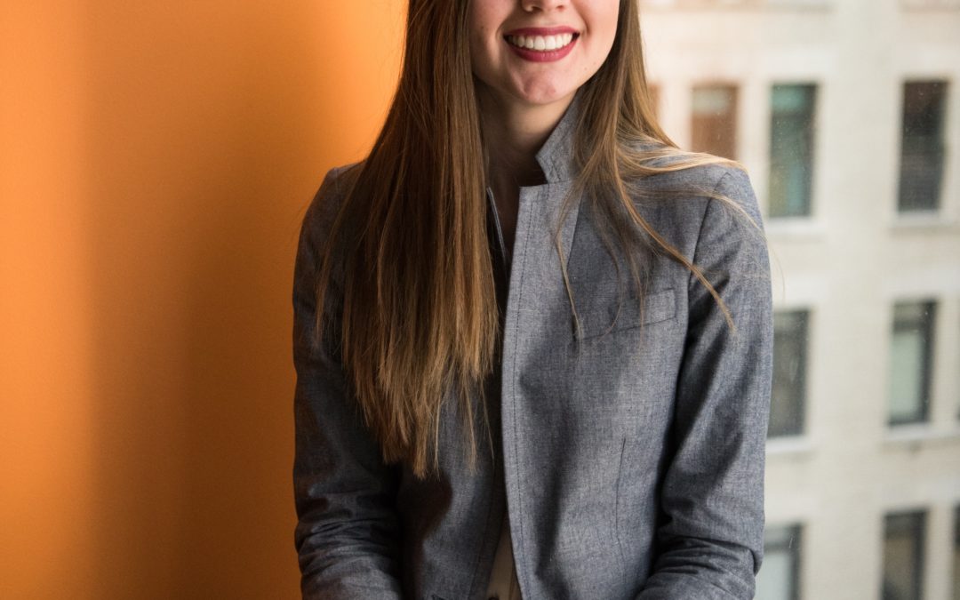 shallow focus photo of woman in gray jacket