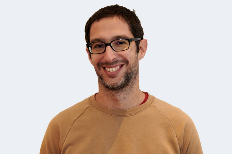 man in black jacket smiling